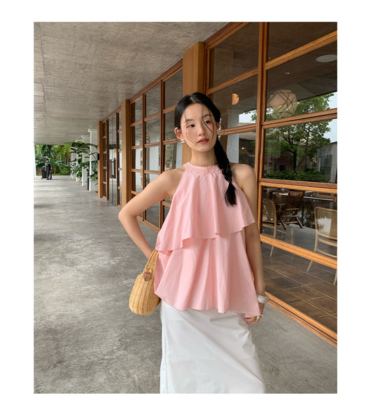 A beautiful halterneck shirt with ruffled edges and sleeveless tops
