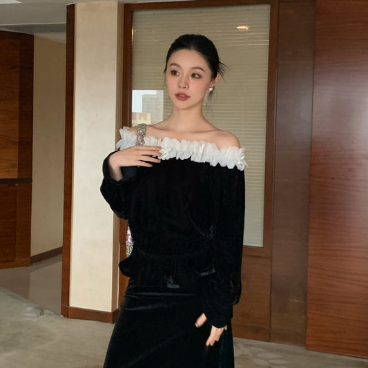 A one-shoulder velvet top with a string of shoulders spliced with fungus