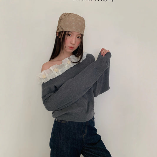 A beautiful lace slanted shoulder open-back knit sweater